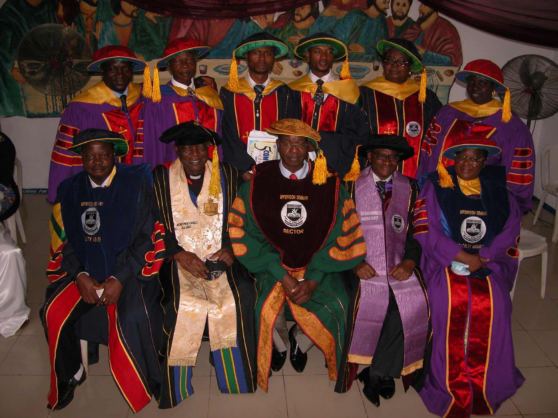 The president and some faculty members with the graduates